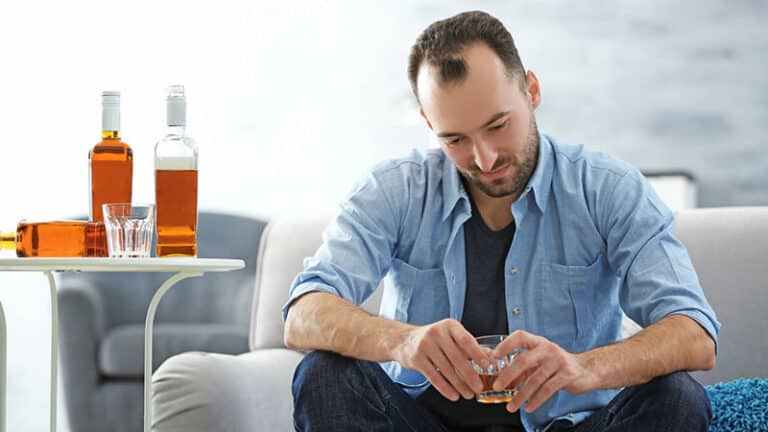 depressed man drinking alcohol