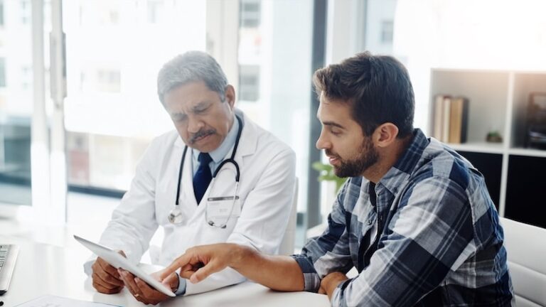 Healthcare doctor and patient in consultation with tablet, expert advice, discussion and results.