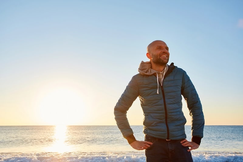 man standing on the beach