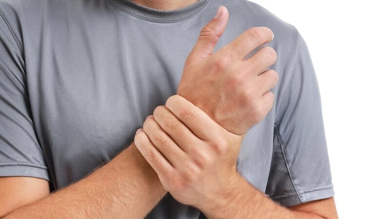 young man suffering from numbness in hands