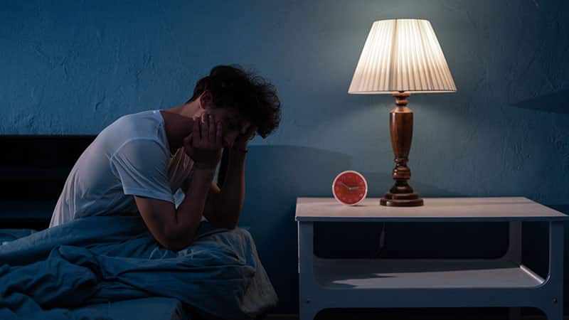 man suffering from insomnia